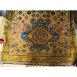 A Persian style peach and beige ground rug, 132cm x 170cm
