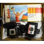 A Polaroid Colorpac 80, a Kodak Brownie 44A camera outfit boxed, a VP Twin camera and a Kodak Browni