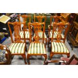 A set of six upholstered dining chairs with pierced splats, raised on cabriole legs including 2 carv