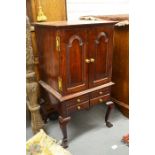 A mahogany music cabinet fitted doors and small drawers, height 82cm
