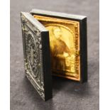 A daguerreotype style miniature portrait of a girl, cased