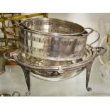 A silver plated food warmer and two pieces of tabl