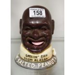 A metal money box, salted peanut man