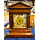 A W. & H. Son oak architectural cased mantle clock, sloped arched top with carved floral decoration.