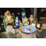 A group of Royal Doulton figures and Poole Pottery