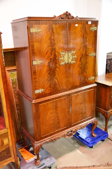 A flamed twin door cocktail cabinet with fittings, above two cupboard doors, with metal mounts - Image 2 of 2