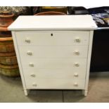 A white chest of drawers, 83cm high, 68cm wide.