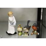 Three Beswick garden birds and a Royal Doulton fig