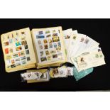 A Stanley Gibbons international stamp album, First Day Covers, loose stamps and printed ephemera