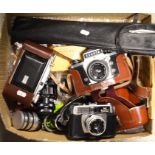 A quantity of assorted cameras and camera equipment
