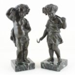 A pair of late 19th century bronze cherubs raised on marble bases, H.13cm