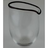 An art glass jug (Simon Moore 1959-Present), having ovaloid shape rim, black/brown rim detail,