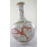 A Chinese early 20th century baluster vase with red dragons chasing a flaming pearl, bearing six