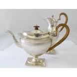An early 20th century silver teapot with matching water jug, hallmarked Sheffield, total approx