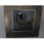 A framed Eastern white metal tribal necklace. 50cm x 38cm, frame size 90cm x 90cm