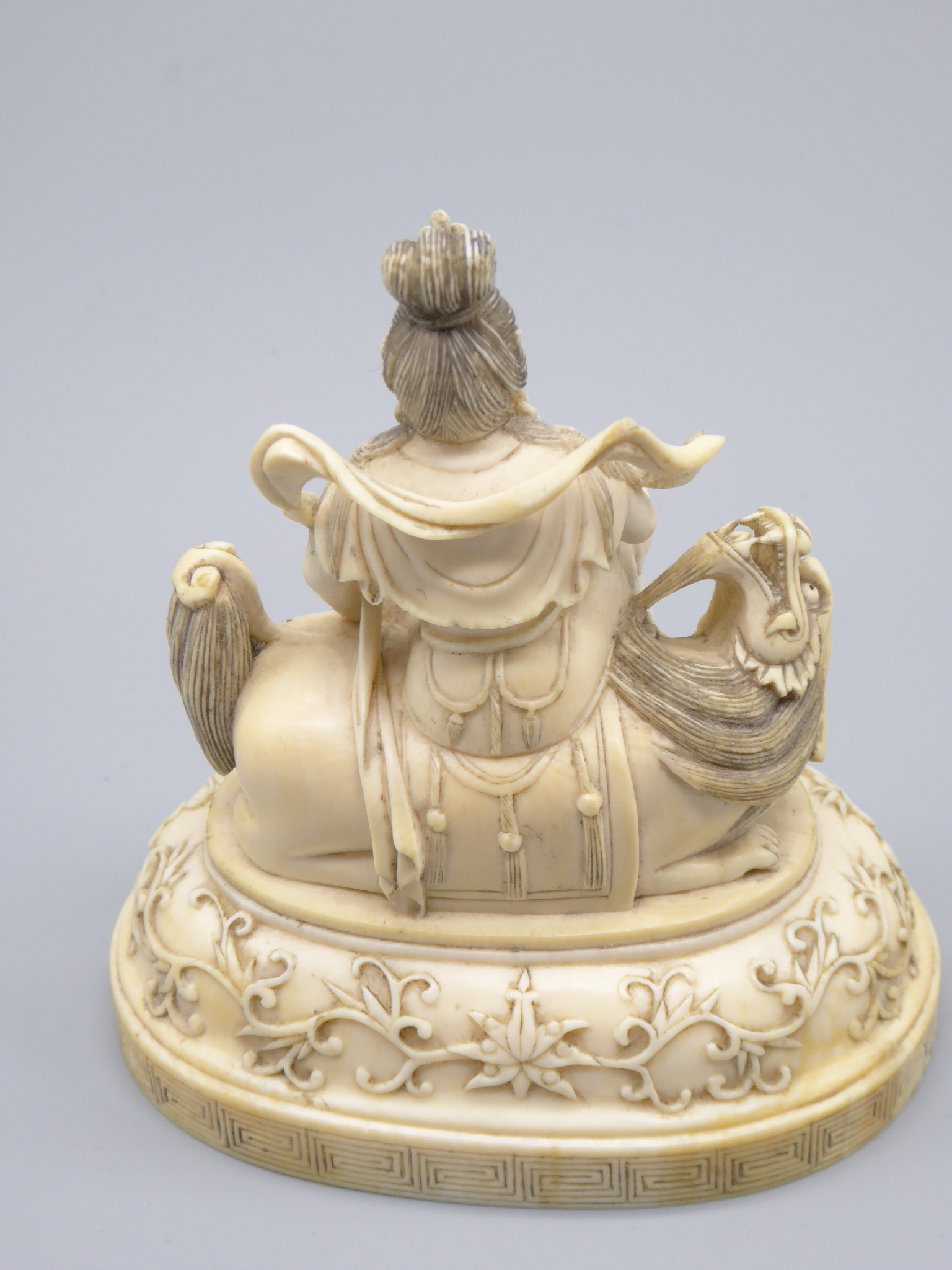 A Chinese 19th century ivory study of a deity, H.9.5cm W.10cm - Image 4 of 4