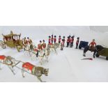 A set of Britains Coronation figurines comprising of horseback guards, queens guards, chariot and