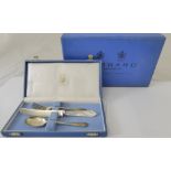 A Garrard silver christening set, comprising of a silver fork and spoon, hallmarked Sheffield and a
