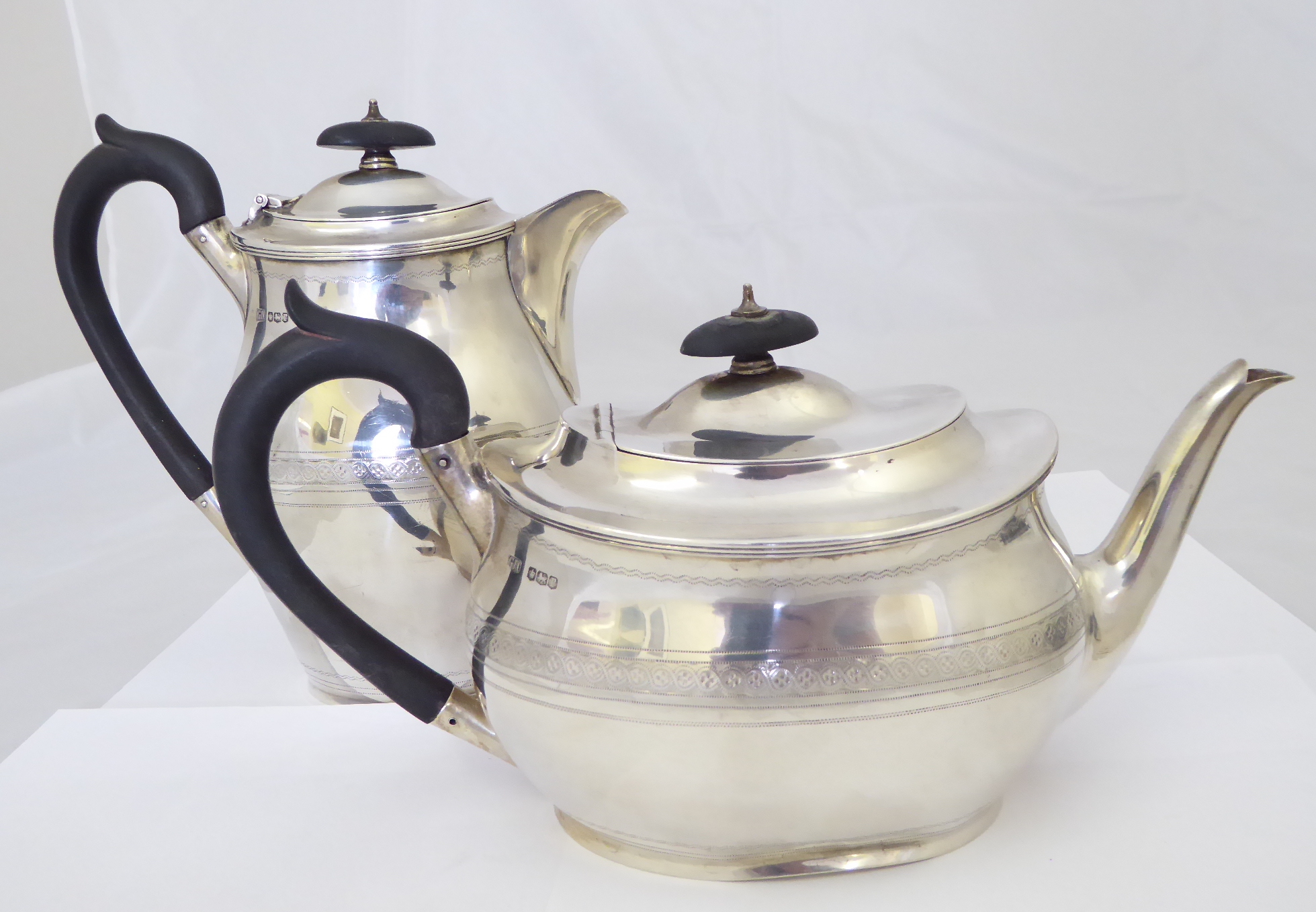 A silver teapot with matching water pot, hallmarked Sheffield 1934, maker George Howson, approx