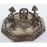 An Indian silver Hindu shrine group consisting of two crawling baby Krishna and the elephant head