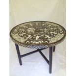 A Chinese circular folding table with mother of pearl inlay, D.66cm