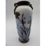 A Rosenthal sterling silver overlaid porcelain vase on a pale blue ground with swans, H.12cm,