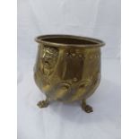 A Victorian brass jardiniere, repousse embossed
