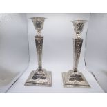 A pair of Neo Classical silver candlesticks, hallmarked Birmingham 1929, maker Burtons & Waters, H.