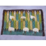 A woven rug featuring stalks and reeds, 97cm x 155cm