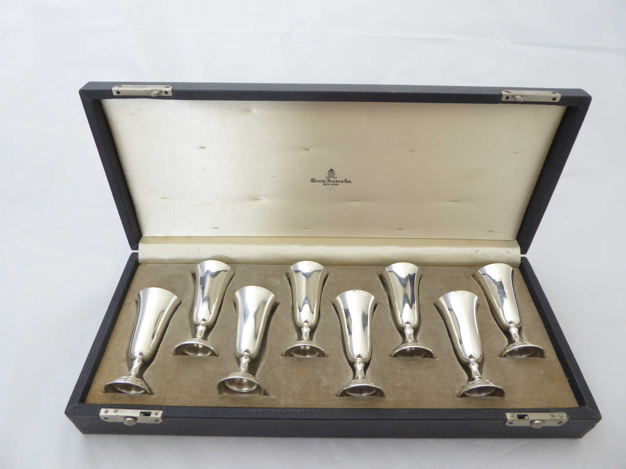 Georg Jensen Inc. New York, a set of 8 sterling silver kiddush cups, stamped 'Randahl' and '