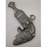 A silver Middle Eastern Khanjar dagger, filigree decor with leather back