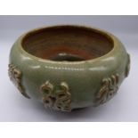 A Chinese celadon glazed bowl with central marking, possibly 18th century, D.21cm