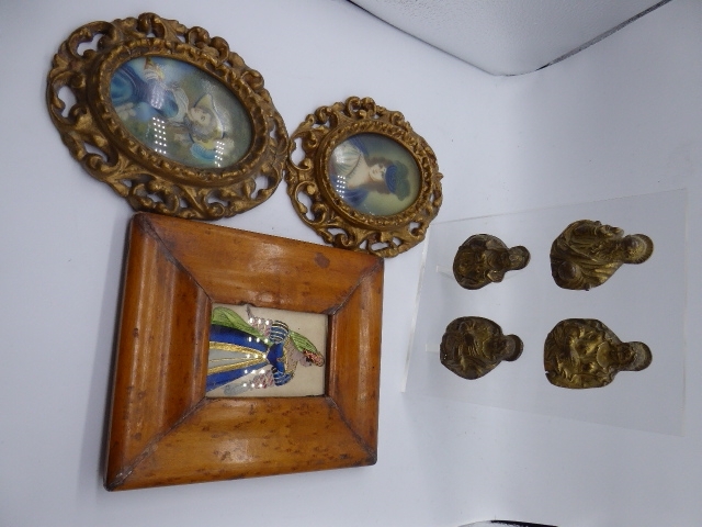 Three miniature portraits together with four casts of Saints mounted onto perspex stand (4)