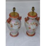 Pair of Chinese ceramic lamp bases, flanked with dogs of fo, H.37cm