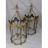 A pair of gilt bronze lanterns, glass panels, late 19th/early 20th century, H.90cm D.45cm