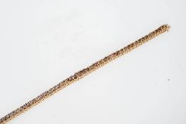 Brillant-Riviere-Armband mit Fancy-Brillanten750er Roségold. Band zur Mitte hin sich leicht