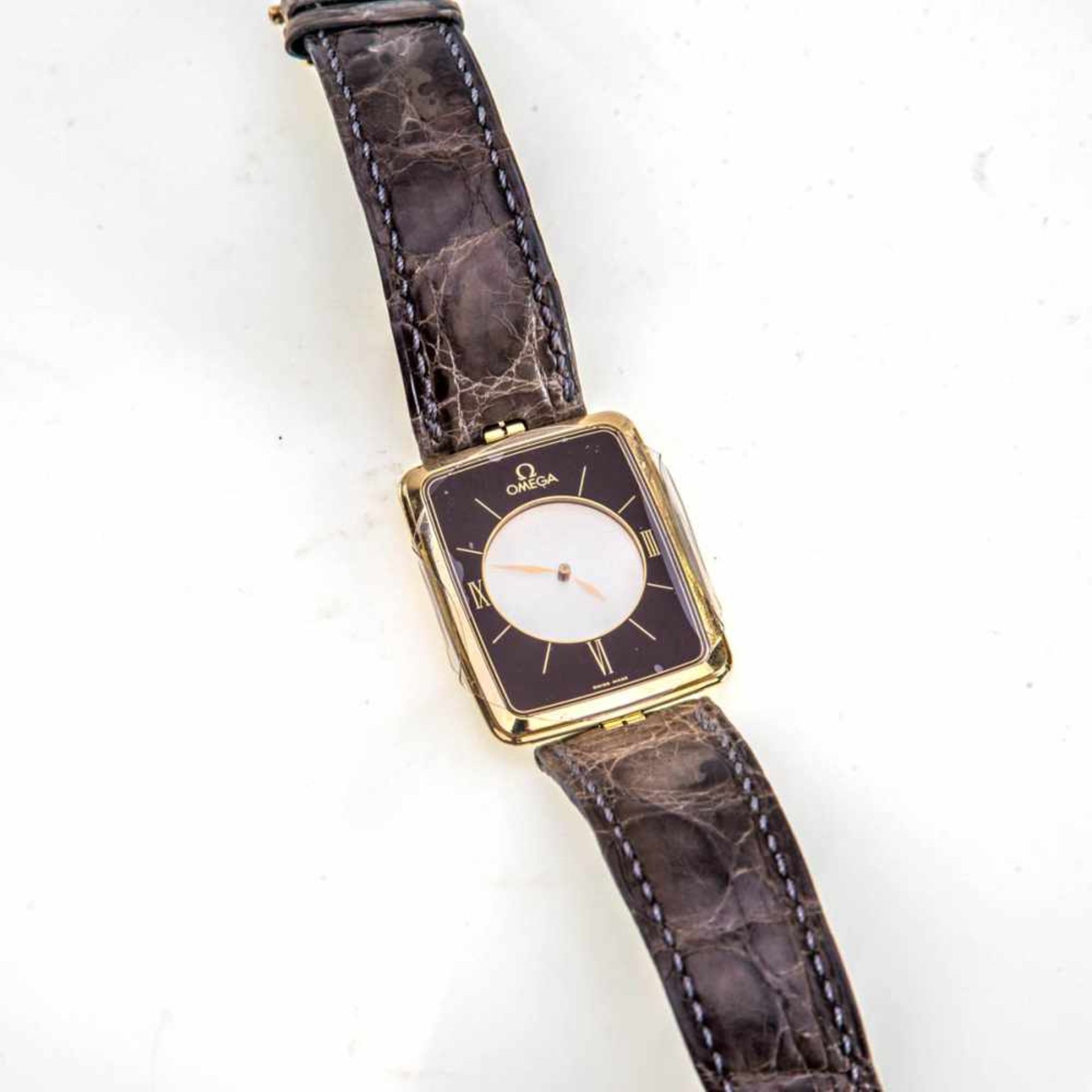 Herren-Armbanduhr, Omega "Mysterieuse"750er Gelbgold. Quarzwerk mit mechanischem Räderwerk,