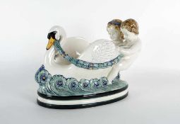 Max Heinze1883 - 1966Schwan mit PuttiFayence, farbig glasiert; H 25 cm, L 32 cm; unten mit der Marke