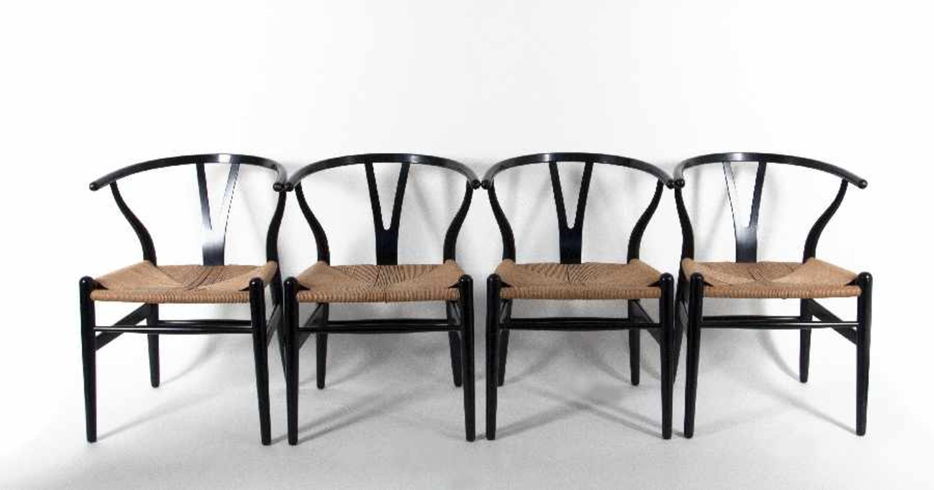 Hans J. Wegner1914 - 20074 CH-24 chairs (Wishbone-chairs)Wood, painted black, bast wickerwork,