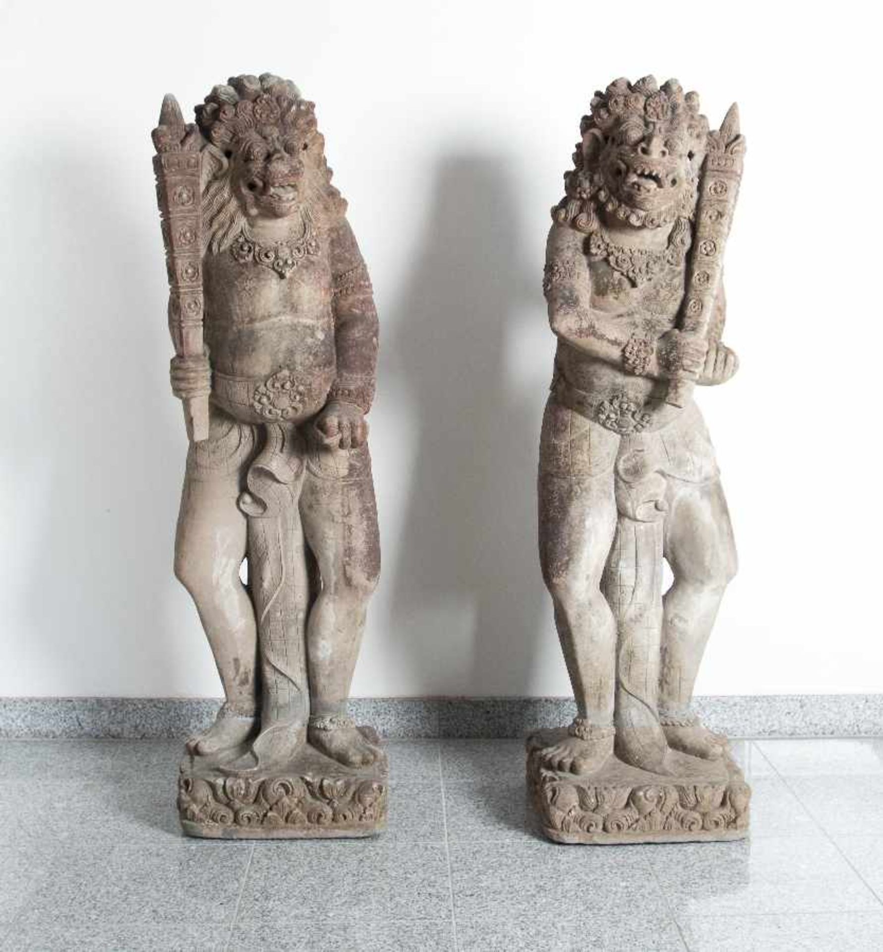 Bali / IndonesiaA pair of demons as guardian figuresCast stone, finished by hand; H each 124 cm; old