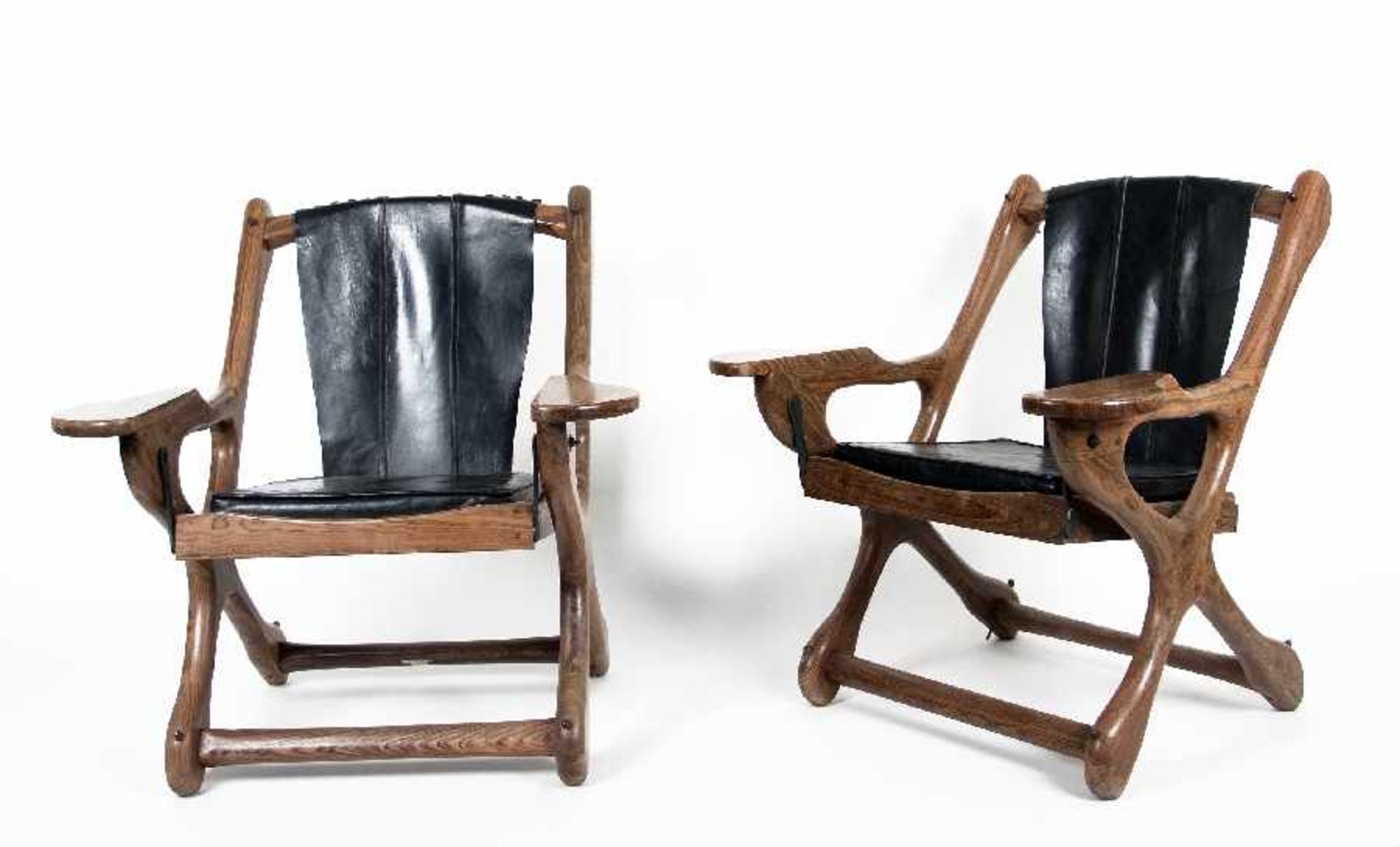 Don Shoemaker1920 - 1990A pair of Sling chairsLeather and tropical wood, 1960; H 88 cm, W 77 cm, D