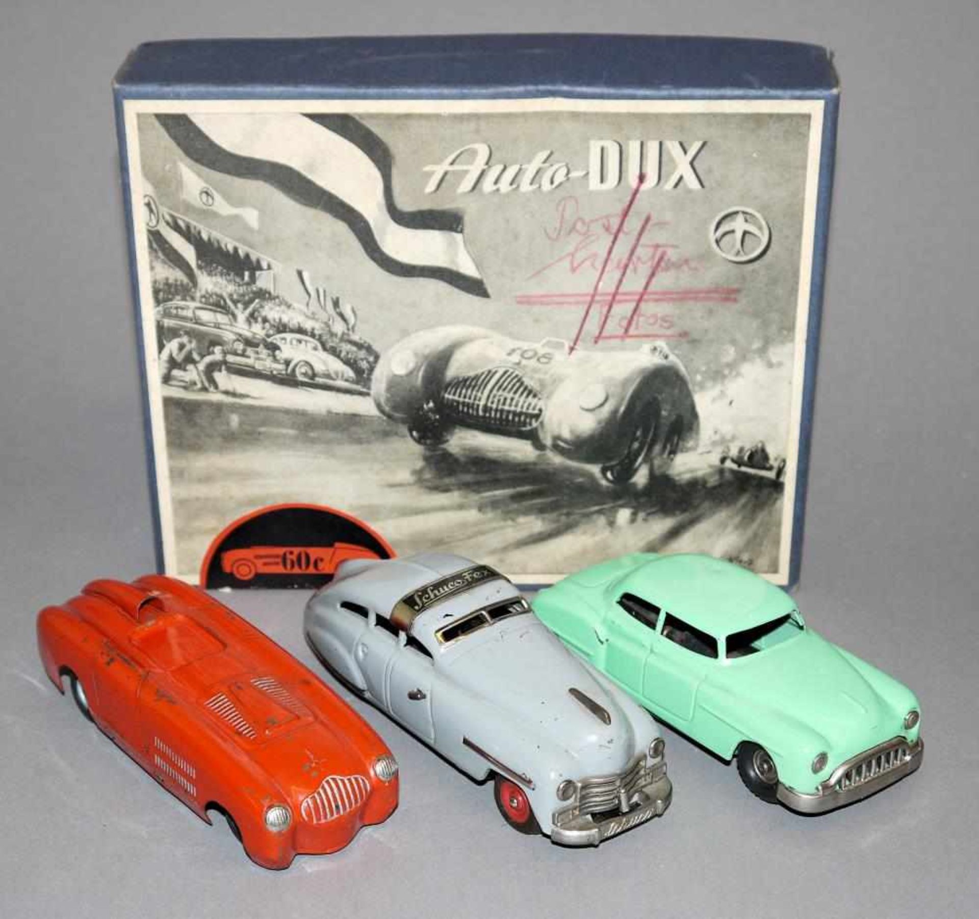 Drei Spielzeugautos, Dux Veritas, Schuco u. Kellermann CKO, 1950er Jahre Auto-Dux roter Rennwagen