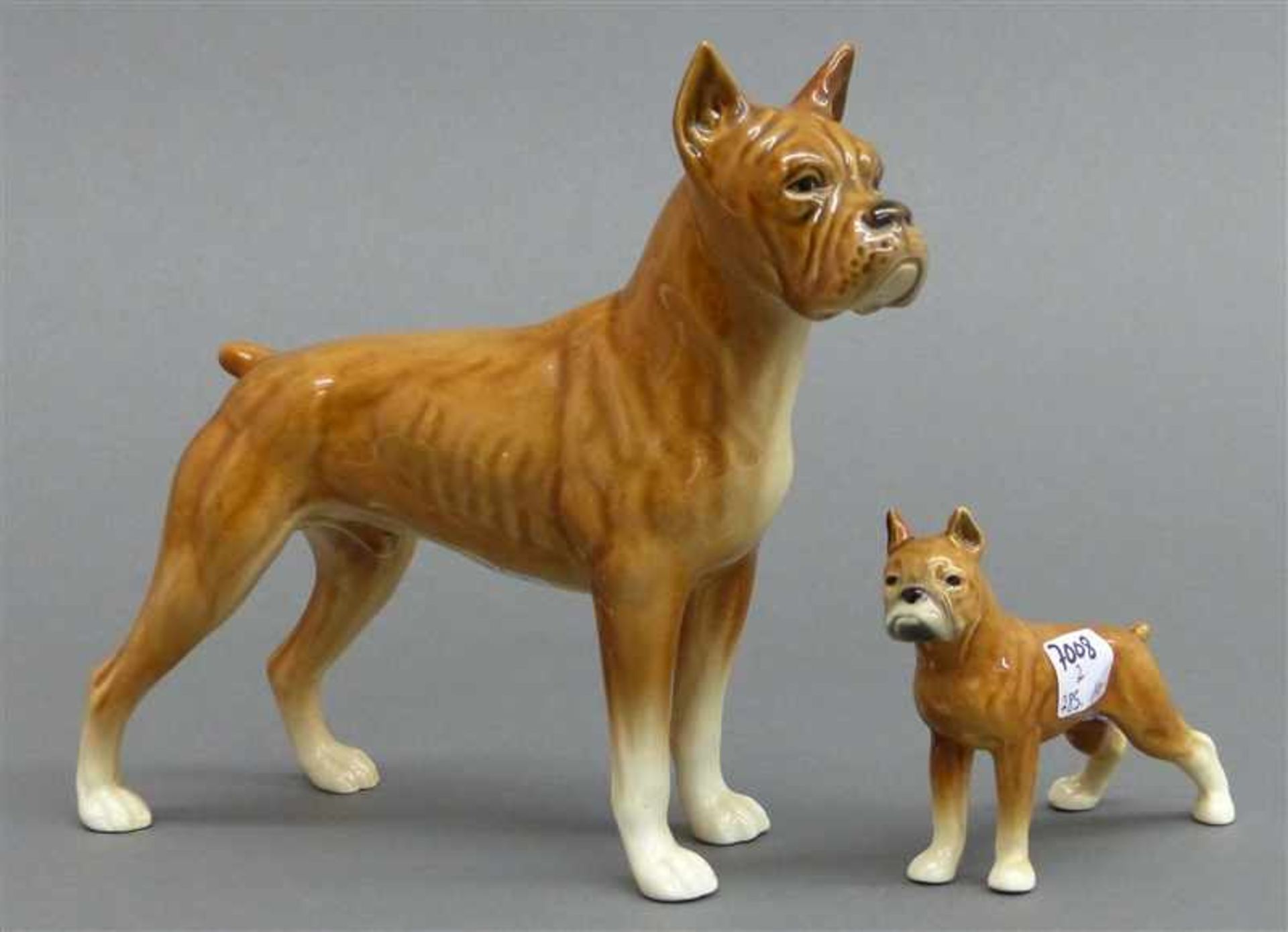 Paar HundefigurenPorzellan, Manufaktur Goebel, bemalt, kleiner und großer Boxer, 70er Jahre, BM, h
