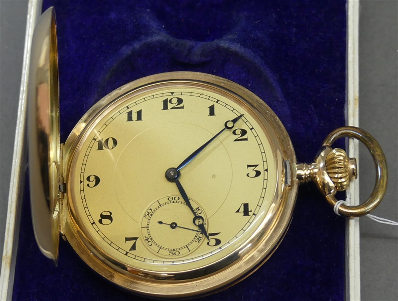 Sprungedekeltaschenuhr14 kt. Gelbgold, Ankerwerk mit Kronenaufzug, goldfarbenes Zifferblatt mit