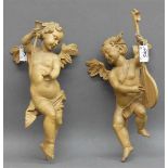 Paar EngelHolz, geschnitzt, mit Laute und Flöte, natur, Grödnertal, 20. Jh., h 26 und 28 cm,- - -