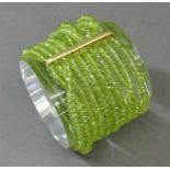 Armband 18 kt. Gelbgold-Steg, 10-reihig, geschliffene Peridots,- - -20.00 % buyer's premium on the