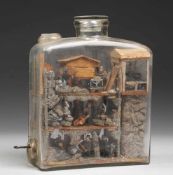 Bergmännische Geduldsflasche (Eingericht)Holz u.a. Materialien. In flaschenförmigem Glasbehälter