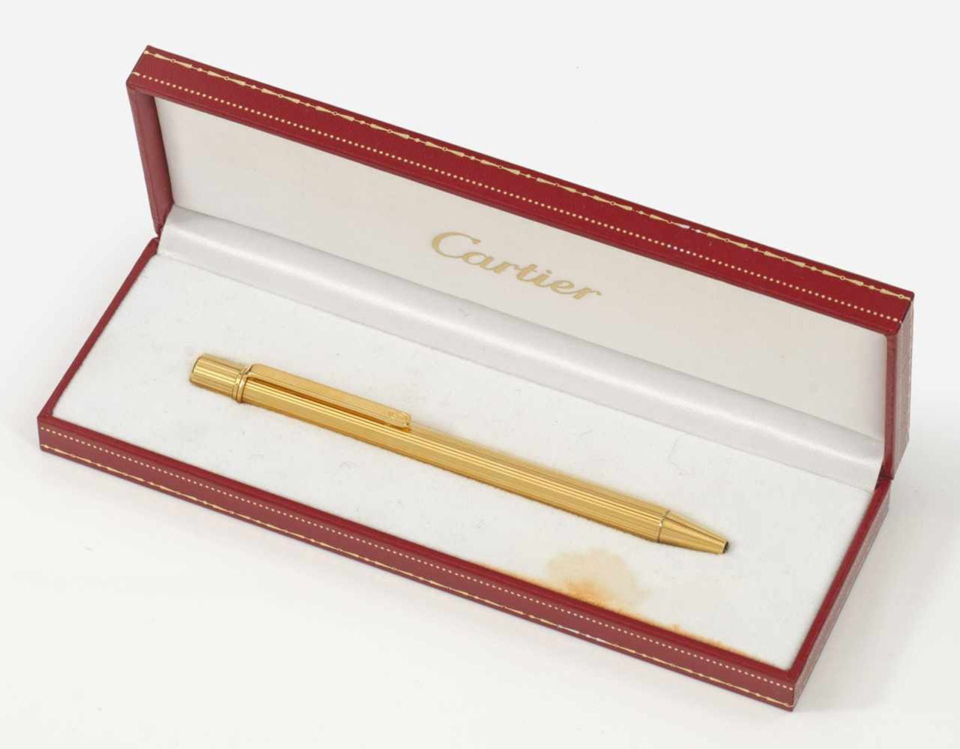 "Must de Cartier" KugelschreiberBox. Metall, vergoldet. Zylinderförmiger, fein godronierter
