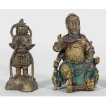 Zwei mythologische FigurenKupfer, teilw. farbig gefasst und vergoldet. Auf einem Drachenstuhl