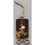 A four-case inrô. Late 18th/early 19th centuryDisplaying a plum blossom branche in takamaki-e and